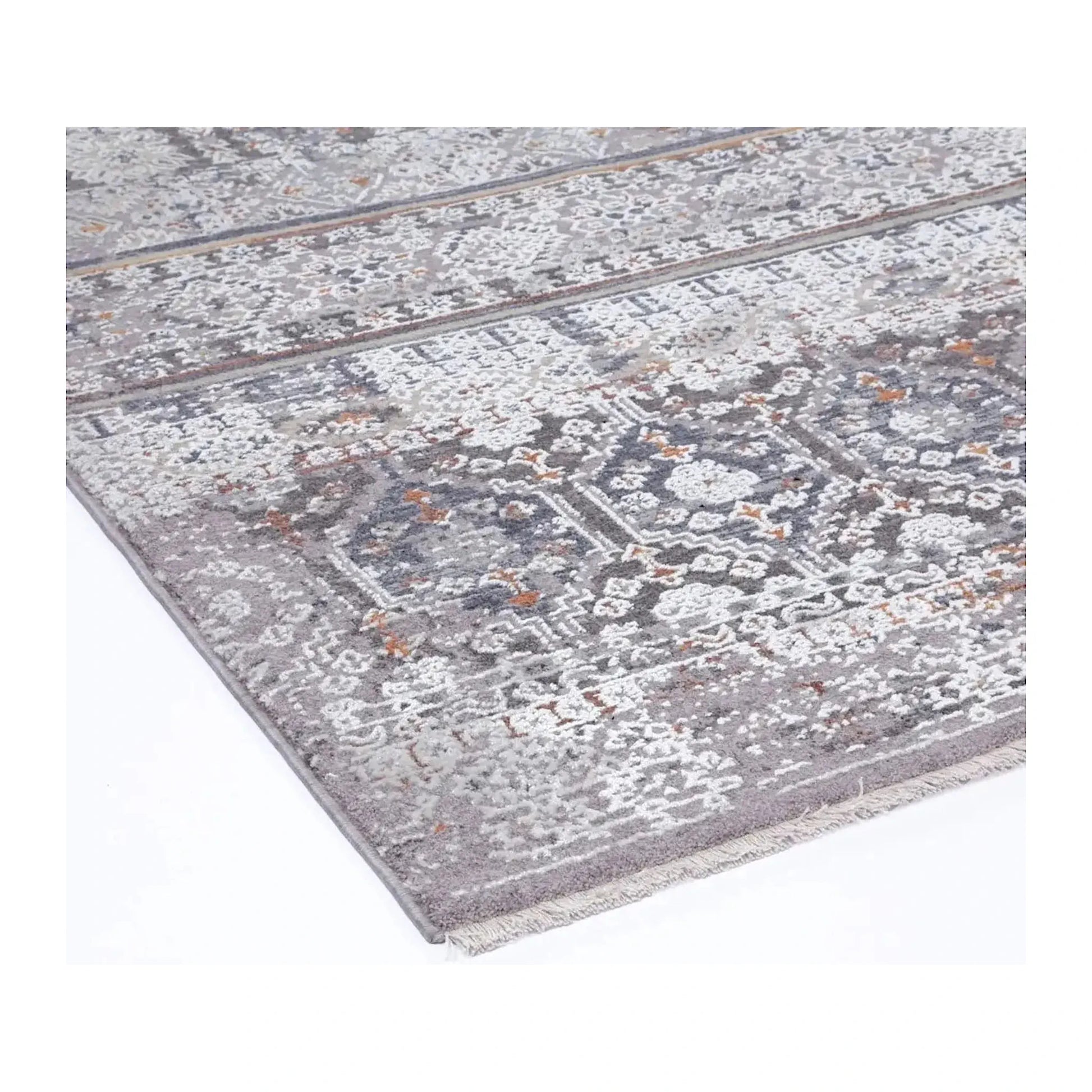 Close view of the patterned surface, edge and short self-fringe in grey, ivory and muted rust