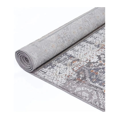 Rolled view showing the patterned front and backing of the Turkish machine-made rug