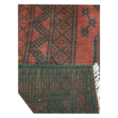 Close-up of Turkoman rug back and border detail showing geometric pattern and woven structure