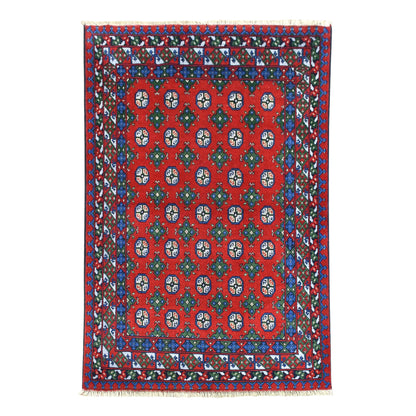 Full view of Turkoman rug with vivid red field, 35 octagonal guls and multicoloured geometric borders, 201 x 150 cm