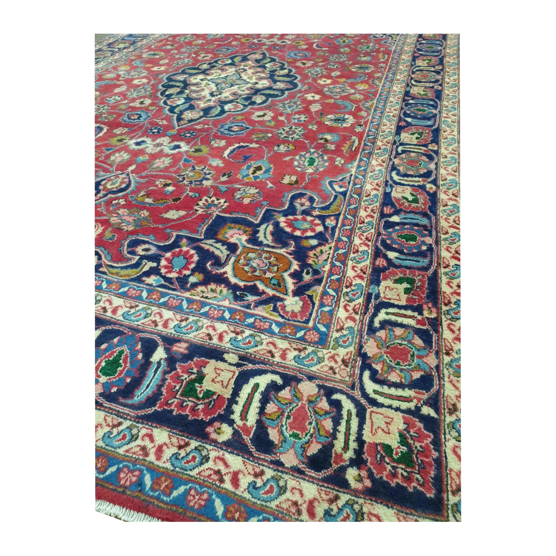 Angled corner border detail of Vintage Mashad wool rug with deep navy border, rose-red field and floral accents, 290 x 186 cm