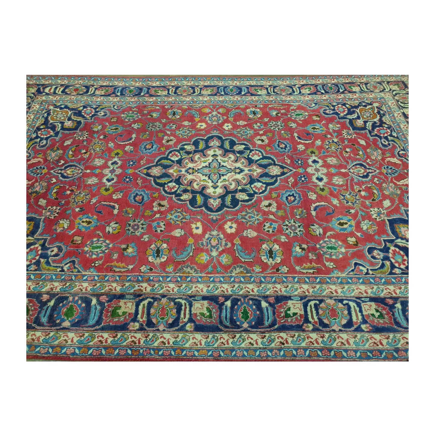 Upper border and field detail of Vintage Mashad wool rug with rose-red floral field and deep navy border, 290 x 186 cm