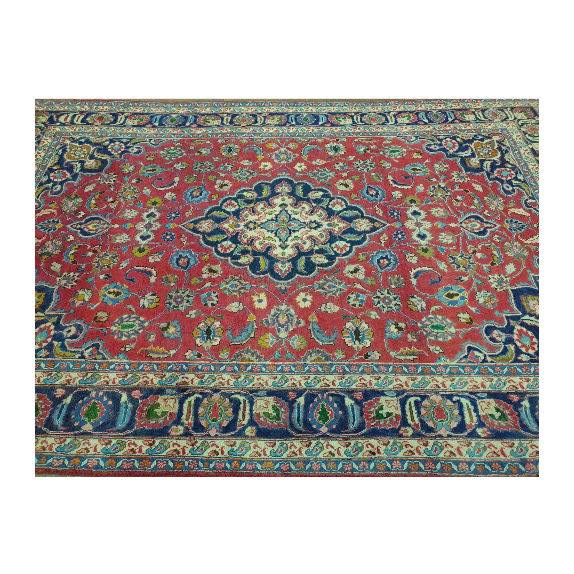 Upper border and field detail of Vintage Mashad wool rug with rose-red floral field and deep navy border, 290 x 186 cm