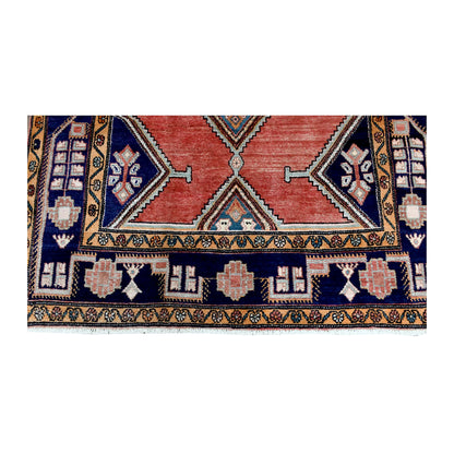 Fringe and end-border detail of vintage Afshar rug with compartmented navy motifs and a mustard geometric guard border