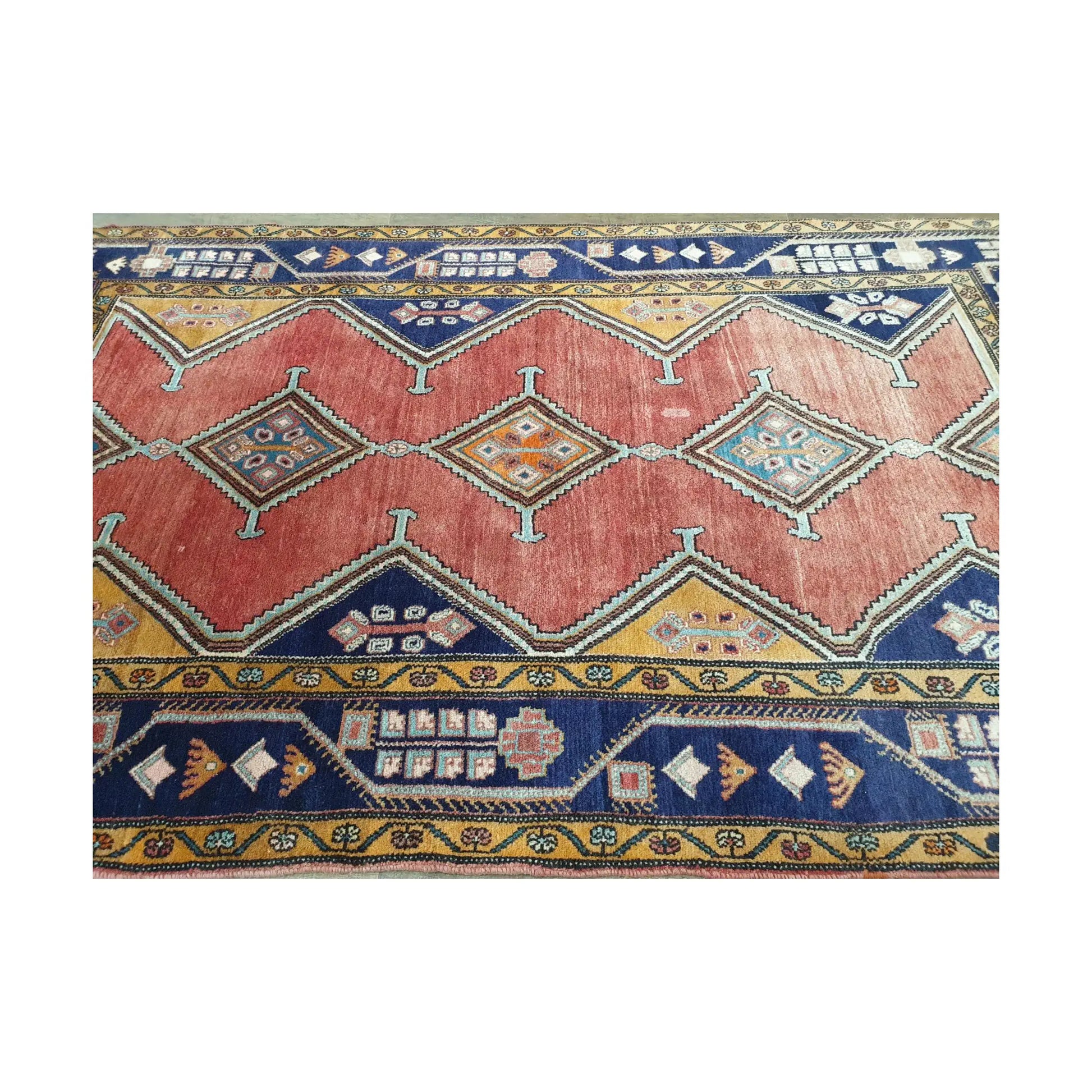 Detail of Vintage Persian Afshar hand-knotted wool rug showing red field, diamond medallions and geometric border, 250 x 147 cm