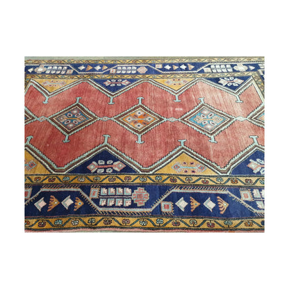 Detail of Vintage Persian Afshar hand-knotted wool rug showing red field, diamond medallions and geometric border, 250 x 147 cm