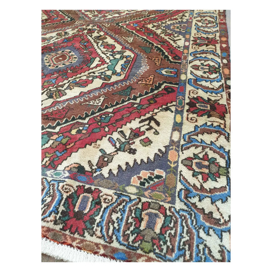Fringe and border detail of vintage Persian Bakhtiari wool rug with geometric motifs