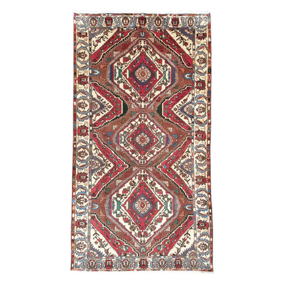Full view of vintage Persian Bakhtiari hand-knotted wool rug 287 x 155 cm with diamond medallion design