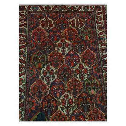 Top field detail of vintage Persian Bakhtiari rug showing garden panel pattern
