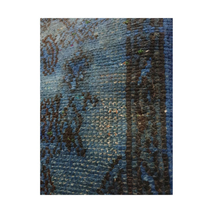 Close-up of lighter blue wool pile and dark charcoal pattern outlines on the vintage Persian cushion cover