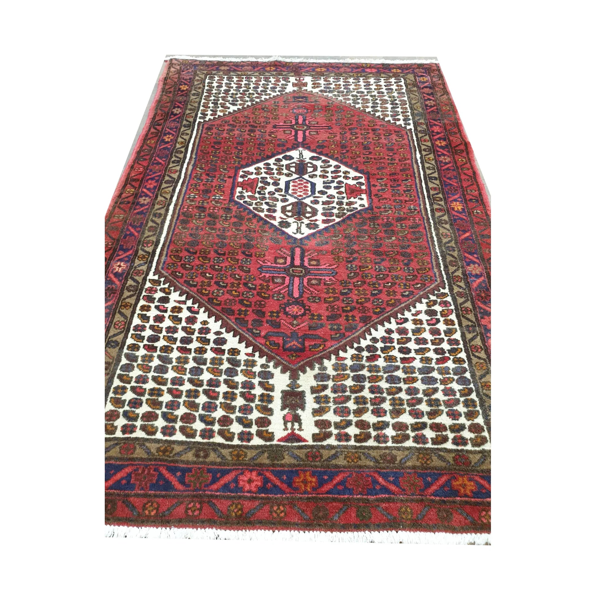 End detail of vintage Persian Hamadan wool rug showing geometric pattern and fringe