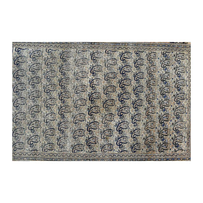 Field detail of vintage Persian rug showing dense rows of dark blue boteh motifs across a soft grey ground