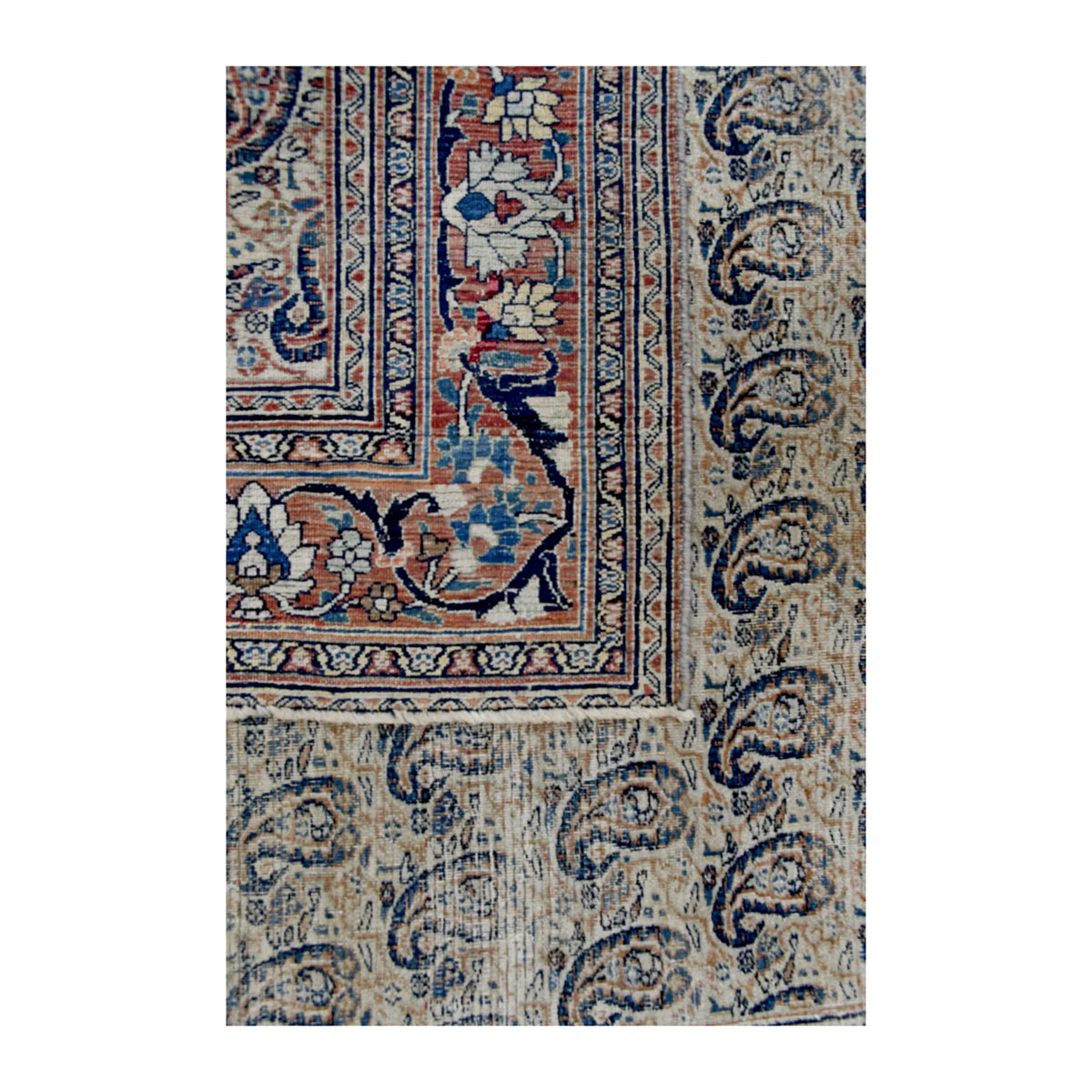 Folded-corner detail of Mashad Dorakhash rug showing the reverse weave, boteh field and floral border