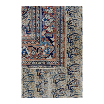 Folded-corner detail of Mashad Dorakhash rug showing the reverse weave, boteh field and floral border