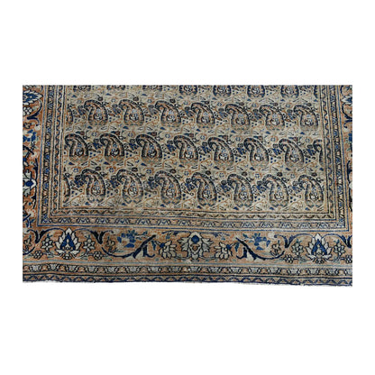 Fringe and end-border detail of Persian Mashad Dorakhash rug with muted blue, rose and terracotta floral motifs