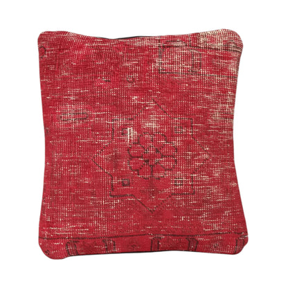 Front view of vintage Persian red overdyed cushion cover with central floral medallion, approximately 45 x 45 cm