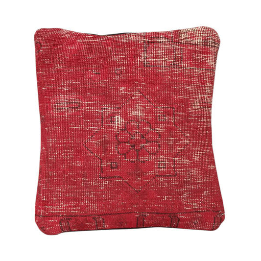 Front view of vintage Persian red overdyed cushion cover with central floral medallion, approximately 45 x 45 cm