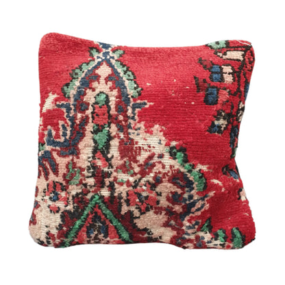 Front view of vintage Persian red rug cushion cover with fragmented multicolour floral pattern, approximately 45 x 45 cm