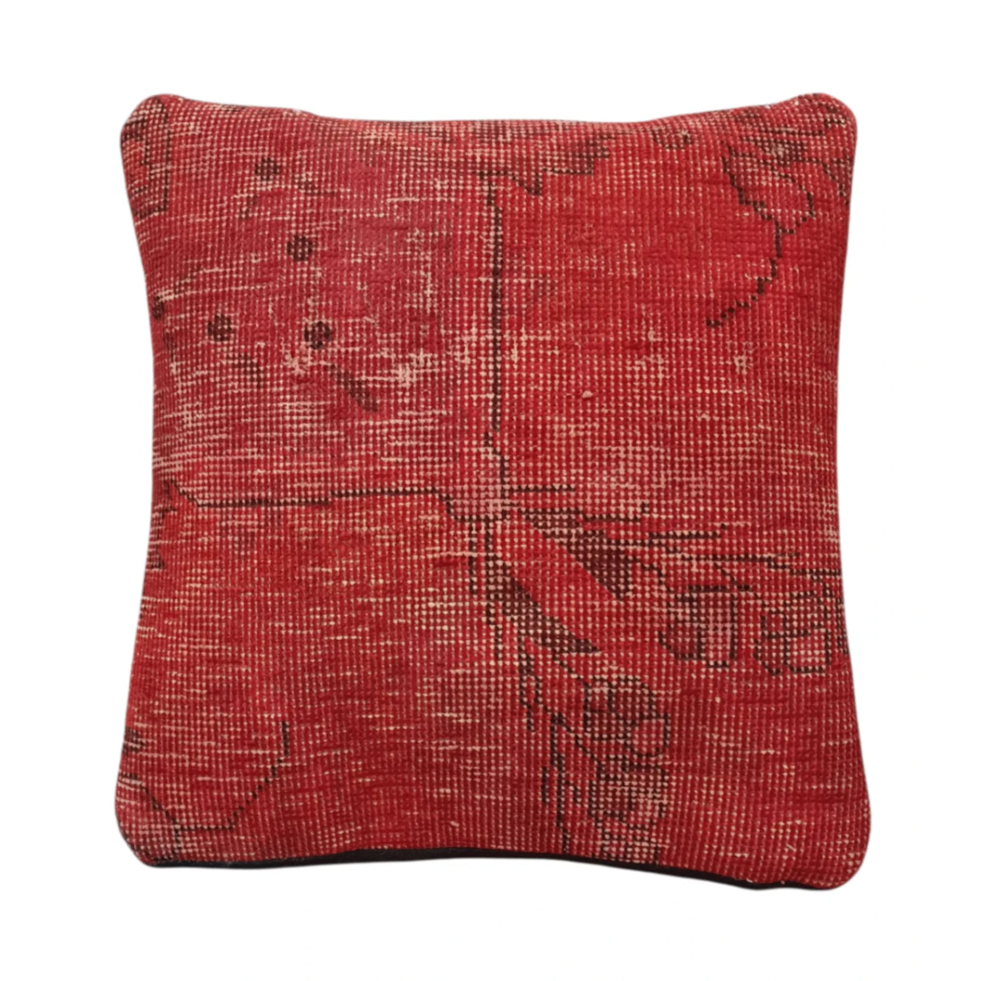 Front view of vintage Persian red overdyed cushion cover with faded geometric pattern, approximately 45 x 45 cm