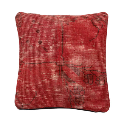 Front view of vintage Persian red overdyed cushion cover with faded geometric pattern, approximately 45 x 45 cm