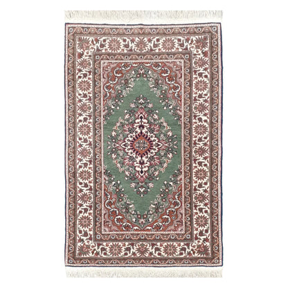Full view of a vintage Persian Tabriz fine hand-knotted wool rug in sage green, 137 x 86 cm