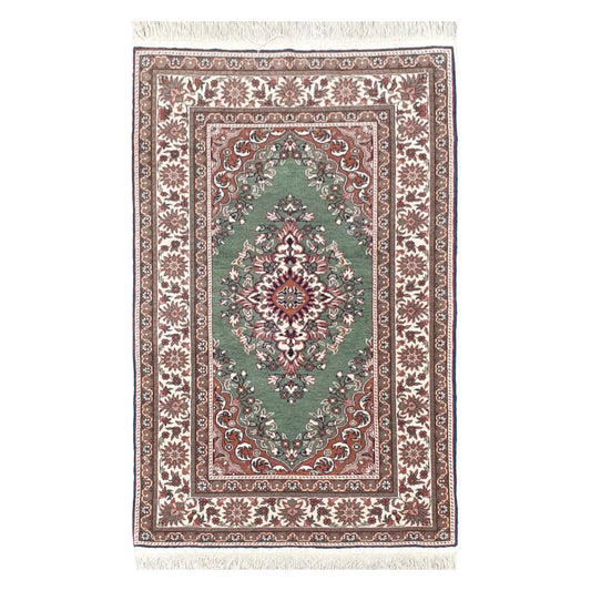 Full view of a vintage Persian Tabriz fine hand-knotted wool rug in sage green, 137 x 86 cm