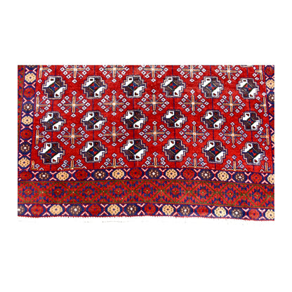 Fringe and end-border detail of vintage Turkoman rug with deep red, dark navy, orange and ivory geometric motifs