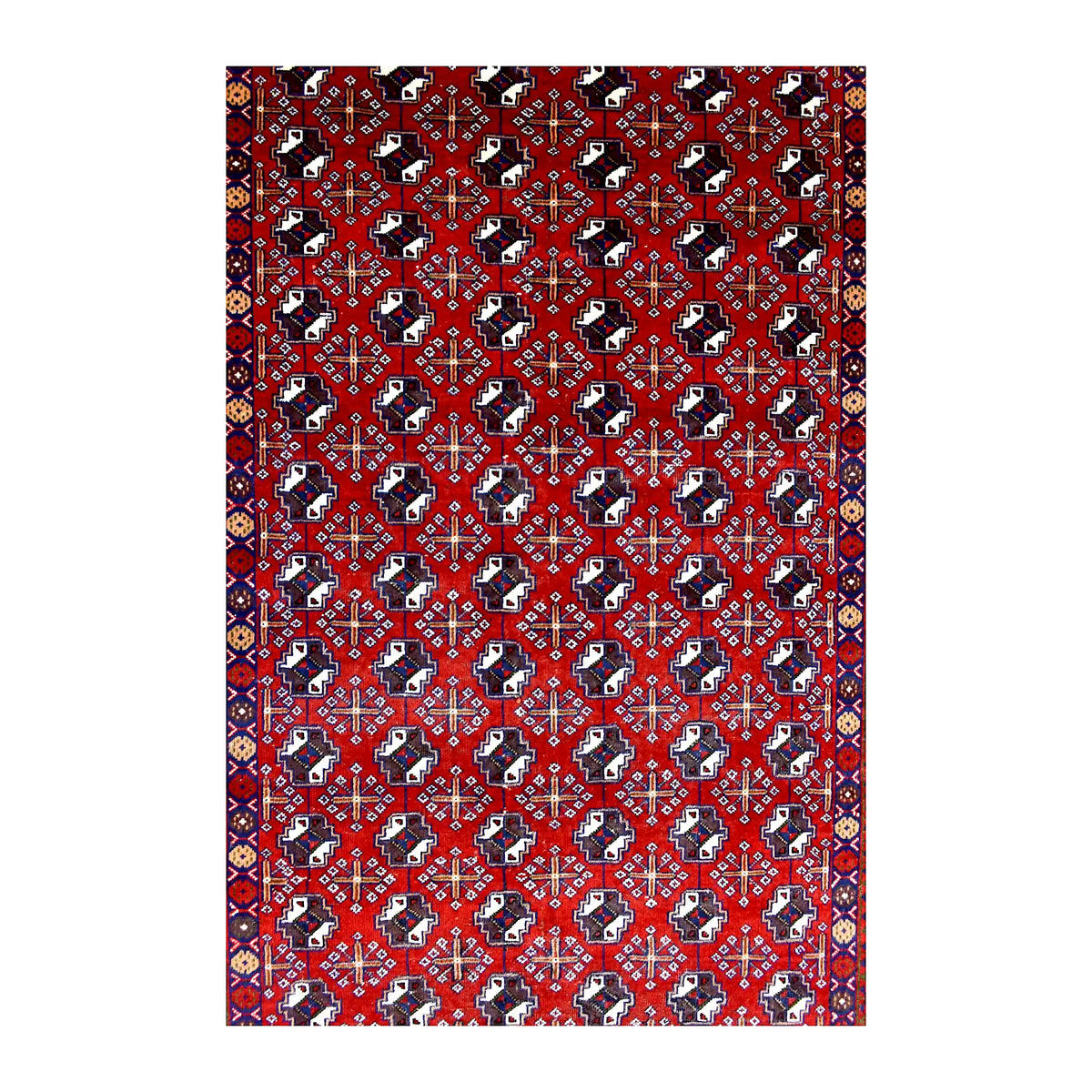 Field detail of Persian Turkoman rug showing close-set gul-style motifs in deep red, ivory and dark navy