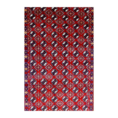 Field detail of Persian Turkoman rug showing close-set gul-style motifs in deep red, ivory and dark navy