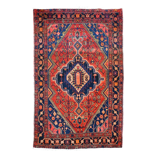 Full view of vintage Persian Zanjan wool rug with brick-red field, dark navy central medallion and layered borders, 200 x 138 cm