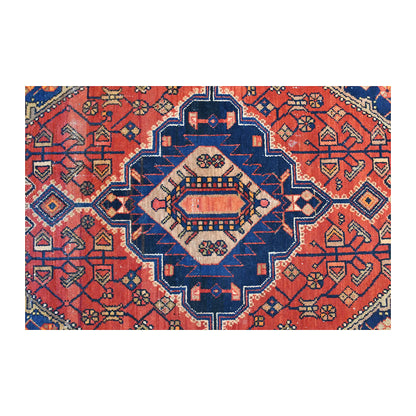 Close-up of the Zanjan rug’s geometric medallion with an ivory centre, dark navy outline and brick-red field