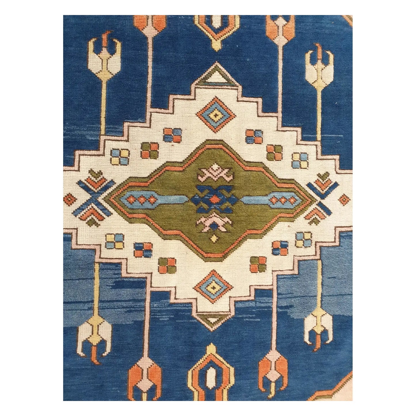 Centre field detail of a vintage Turkish Anatolian rug with stepped geometric motif on a blue ground