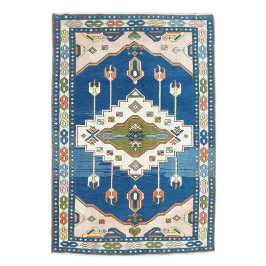 Full view of a vintage Turkish Anatolian hand-knotted wool rug with a blue field and geometric motifs, 206 x 130 cm