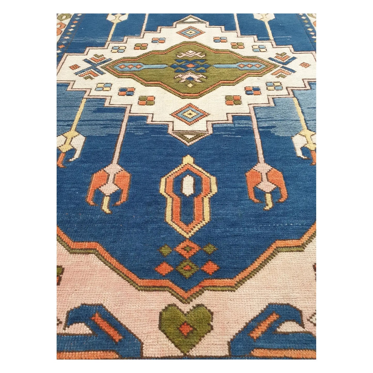 Upper field detail of a vintage Turkish Anatolian hand-knotted wool rug with traditional geometric design