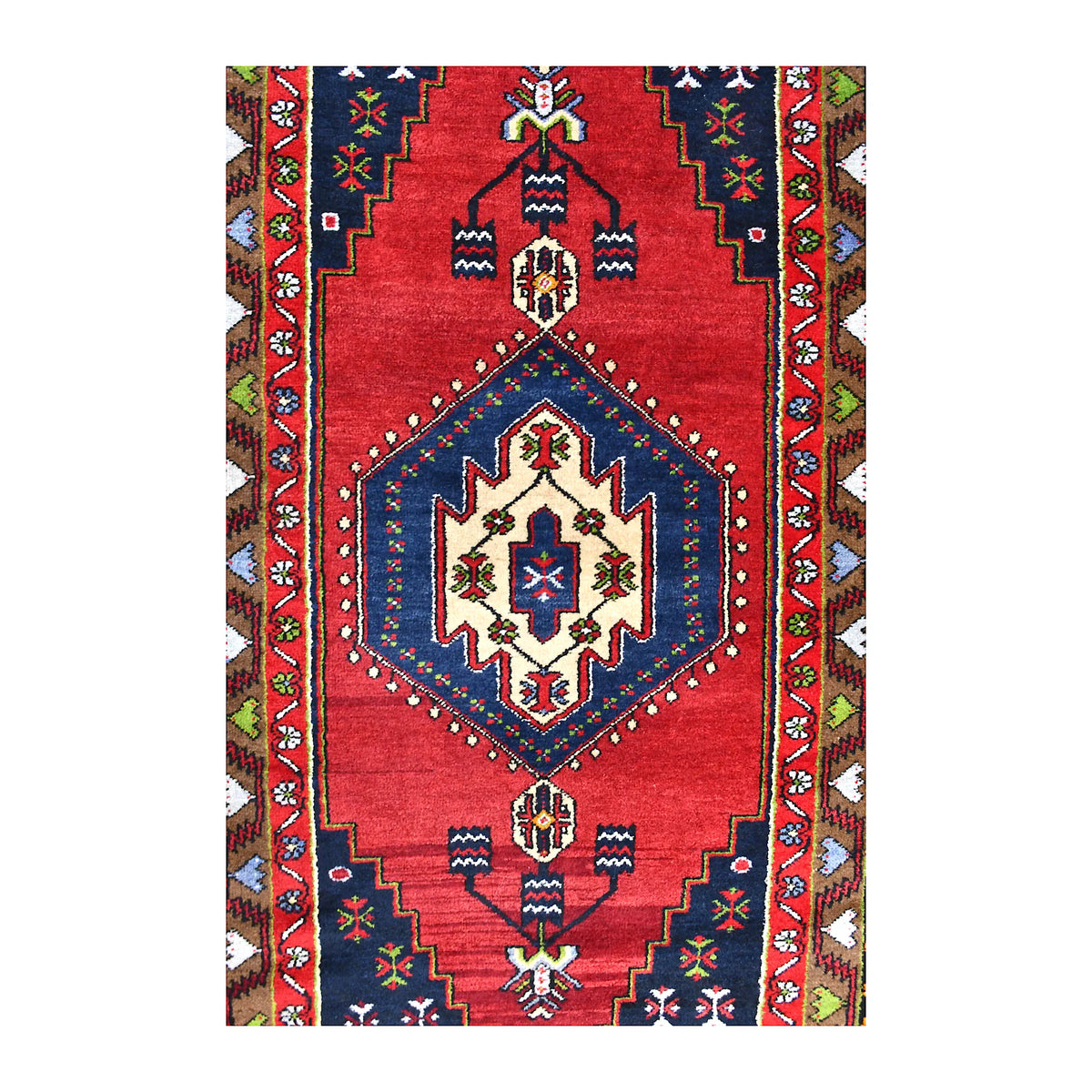 Field detail of vintage Turkish Yahyali rug showing the navy diamond medallion, red ground and smaller geometric motifs