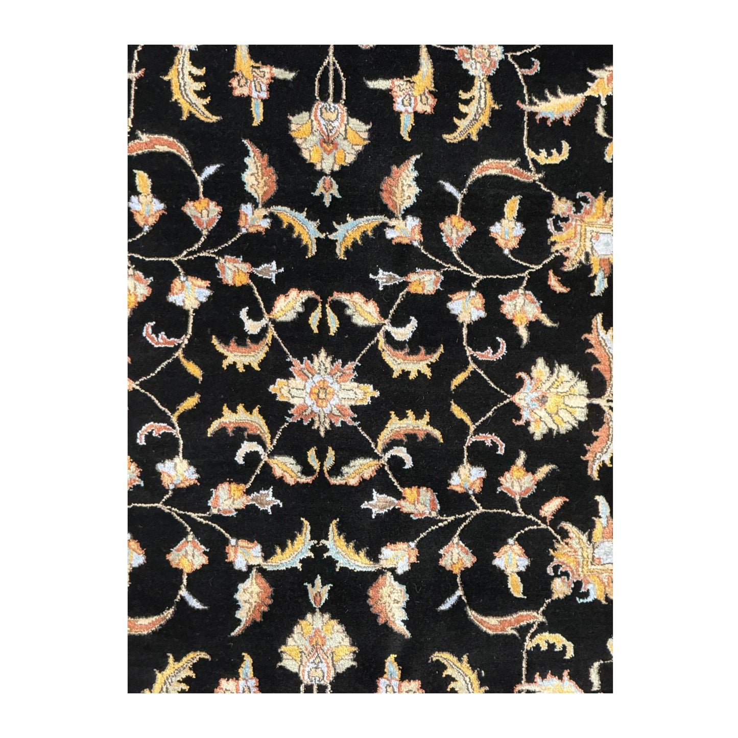 Close-up of black Ziegler rug showing the wool and silk pile with scrolling floral motifs