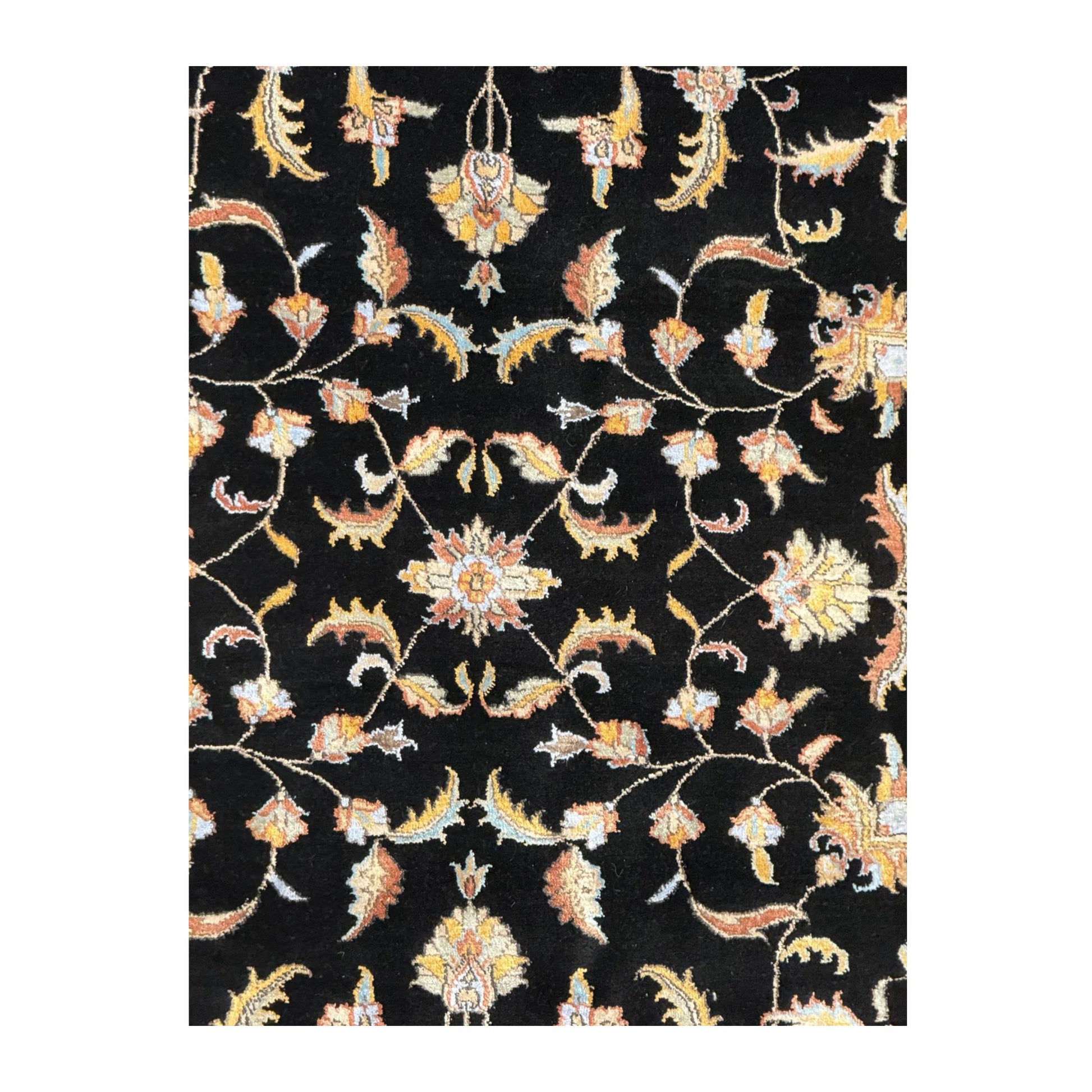 Close-up of black Ziegler rug showing the wool and silk pile with scrolling floral motifs