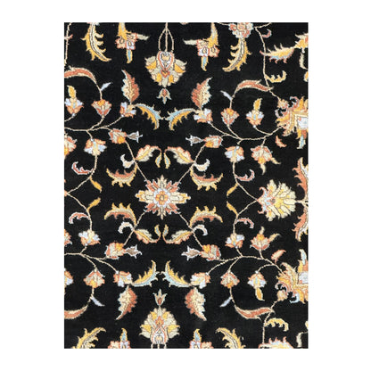 Close-up of black Ziegler rug showing the wool and silk pile with scrolling floral motifs