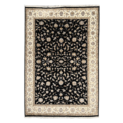 Full view of black Ziegler hand-knotted wool and silk rug with beige floral border, 295 x 196 cm