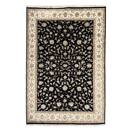 Full view of black Ziegler hand-knotted wool and silk rug with beige floral border, 295 x 196 cm