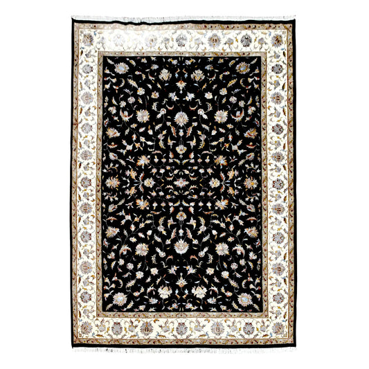 Full view of black Ziegler wool and silk rug with pale floral vines and a broad cream border, 295 x 196 cm